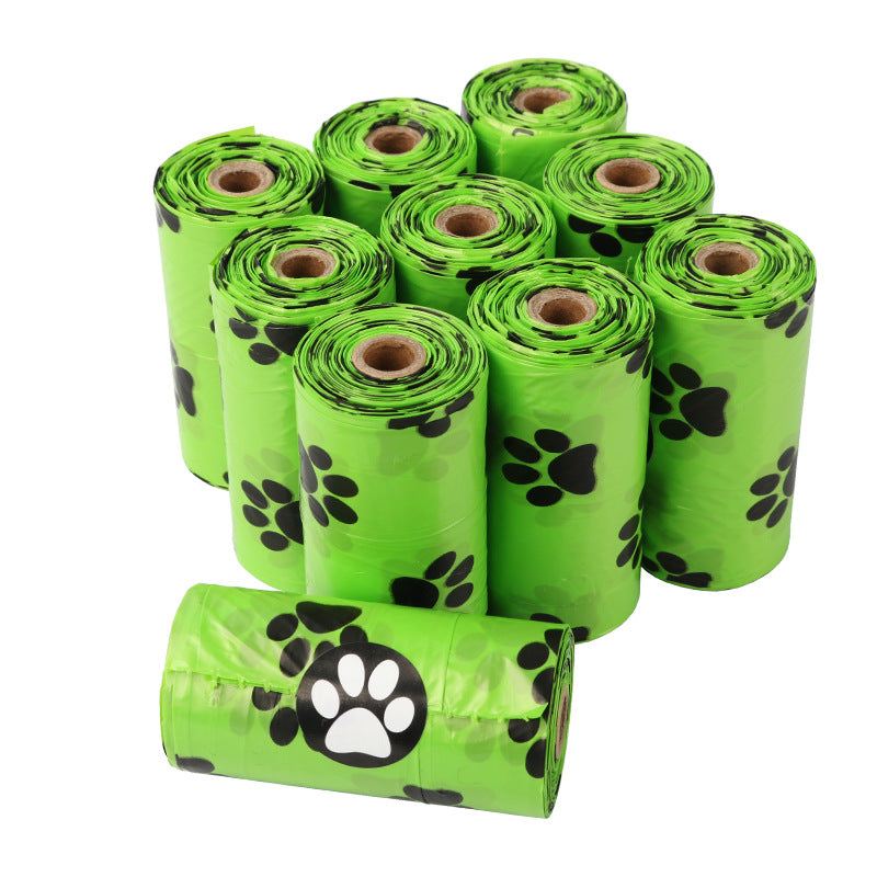 Roll of green biodegradable dog poop bags for pet waste disposal