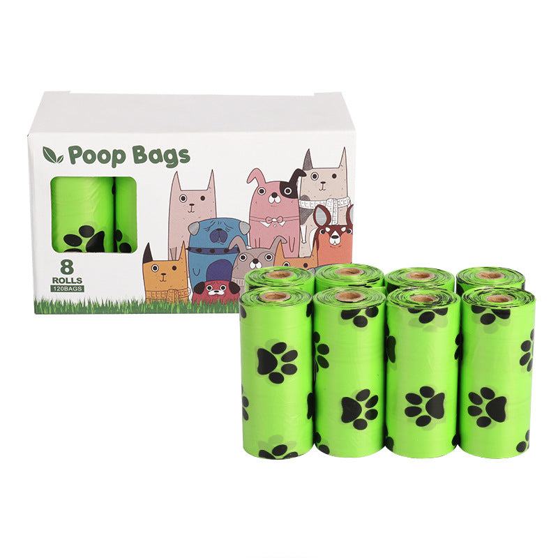 Green roll of biodegradable dog poop bags on white background